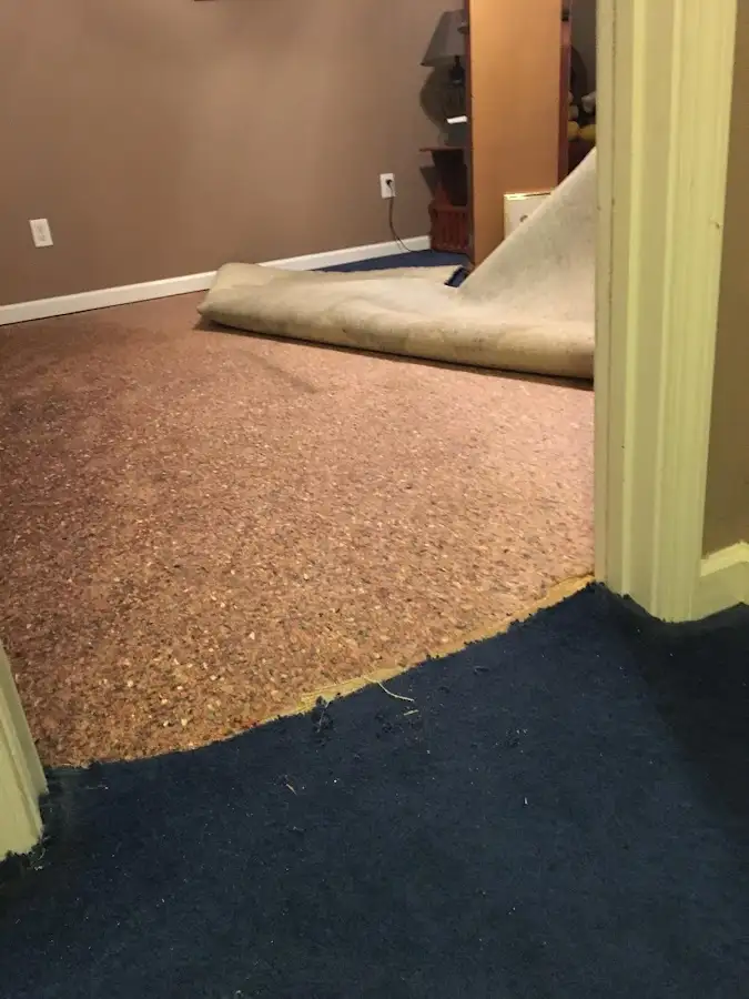 Carpet pad removal revealing water damage during Drying & Dehumidification in Texarkana